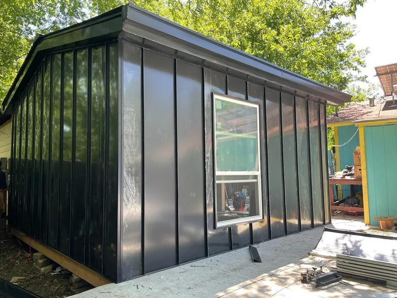 Black standing seam metal wall panels for Roof Inspection in Balm