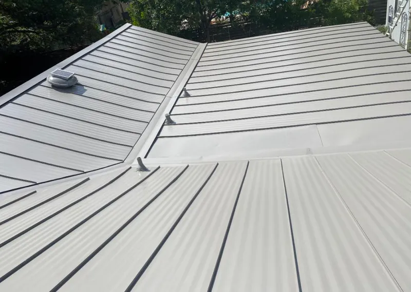 Solar attic fan installed on a metal roof for Roof Ventilation in Balm